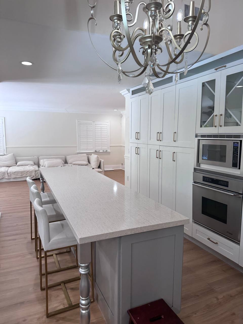 Renovated Sunny Isles kitchen with custom island, cabinetry, and lighting
