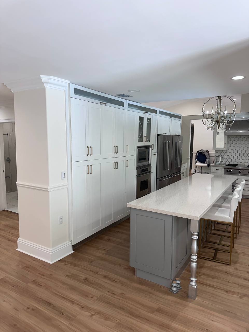 Wide view of the renovated Sunny Isles kitchen and custom cabinetry