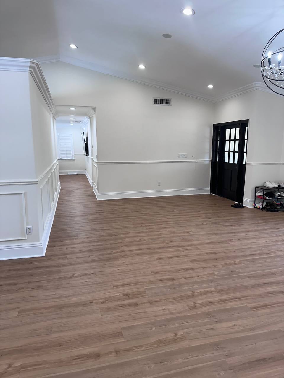 Refreshed Sunny Isles living room with new flooring, trim, and lighting