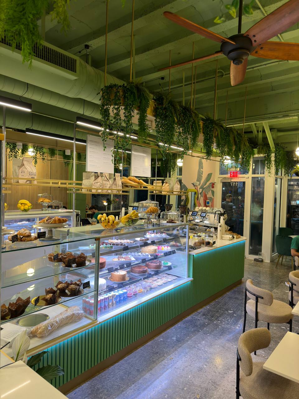 Vanilla Cafe pastry display, service counter, lighting, and exposed ceiling