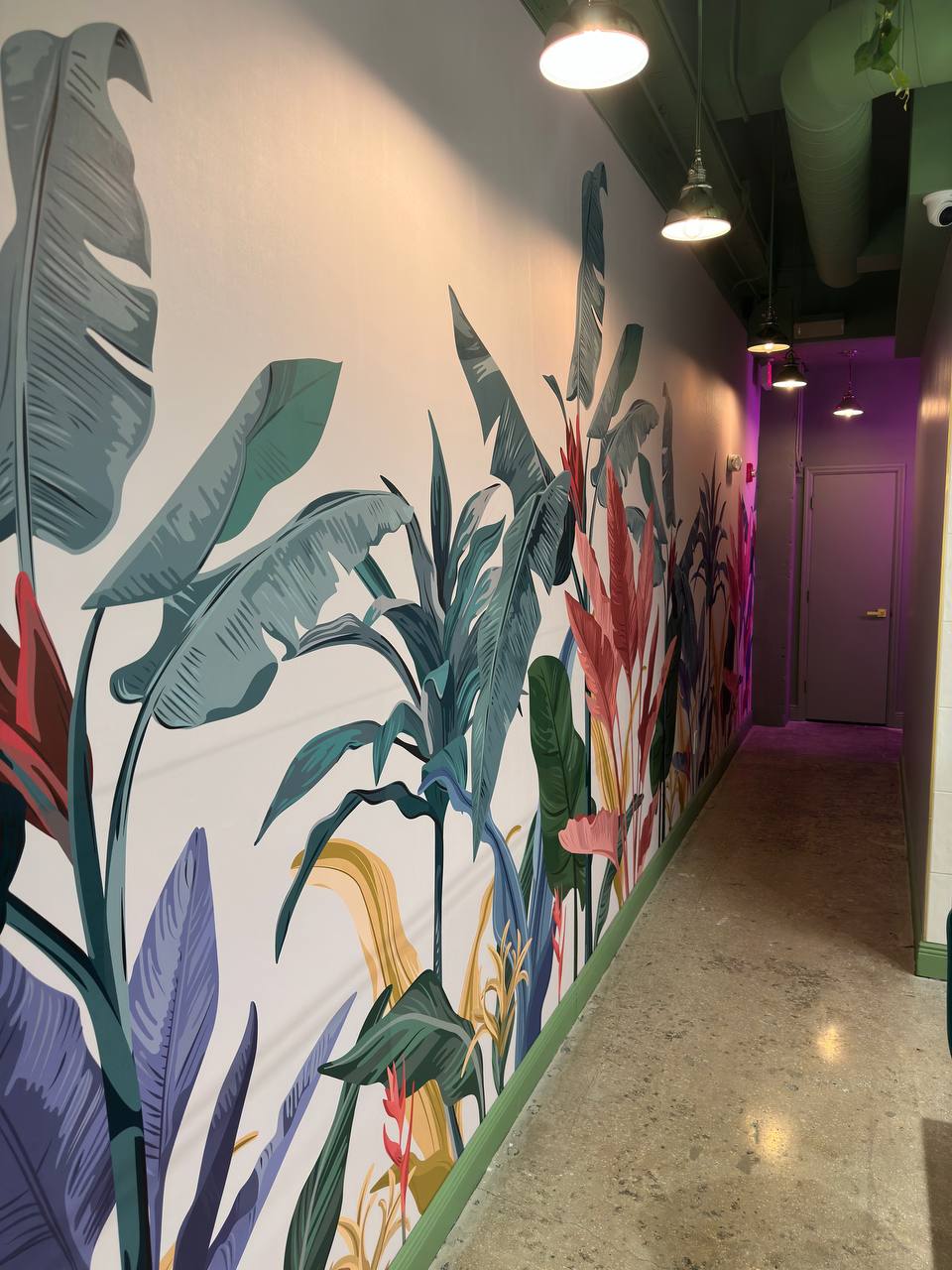 Tropical botanical feature wall inside Vanilla Cafe in Downtown Miami